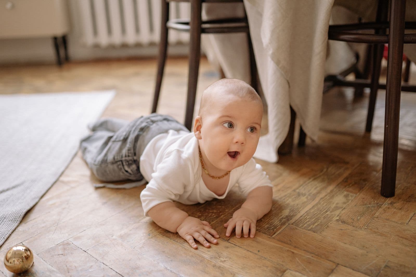 A baby crawling on the floor