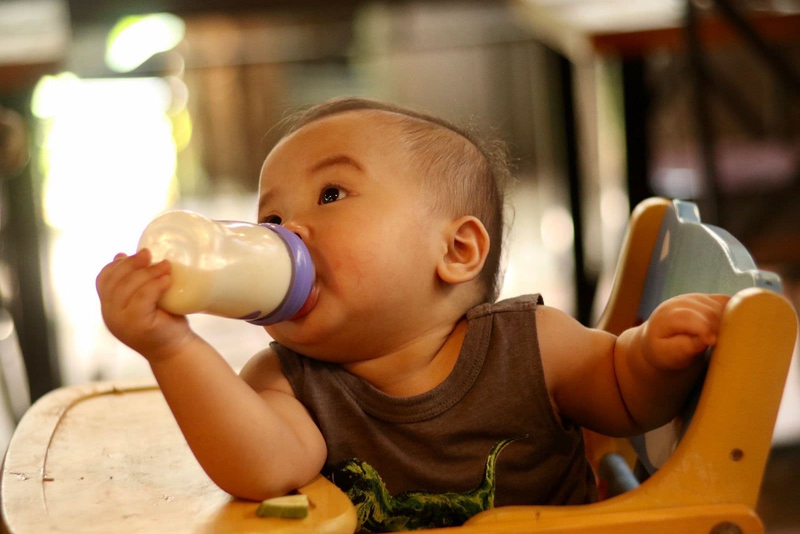 A baby drinking from a bottle