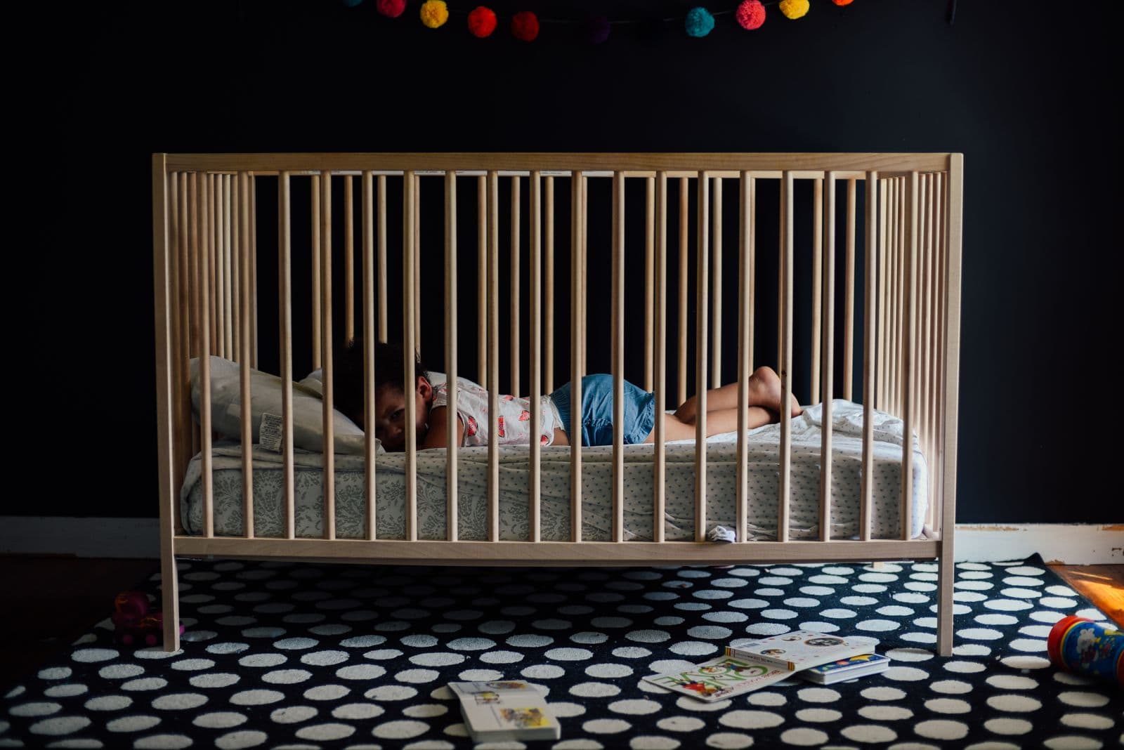 A baby sleeping peacefully in a softly lit nursery