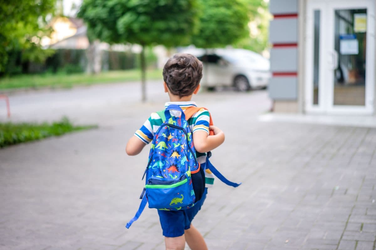 A child wearing a properly fitted school backpack