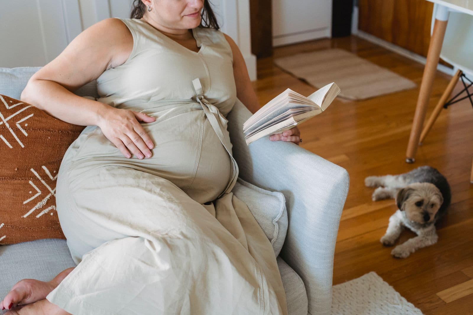 A pregnant woman relaxing with a book
