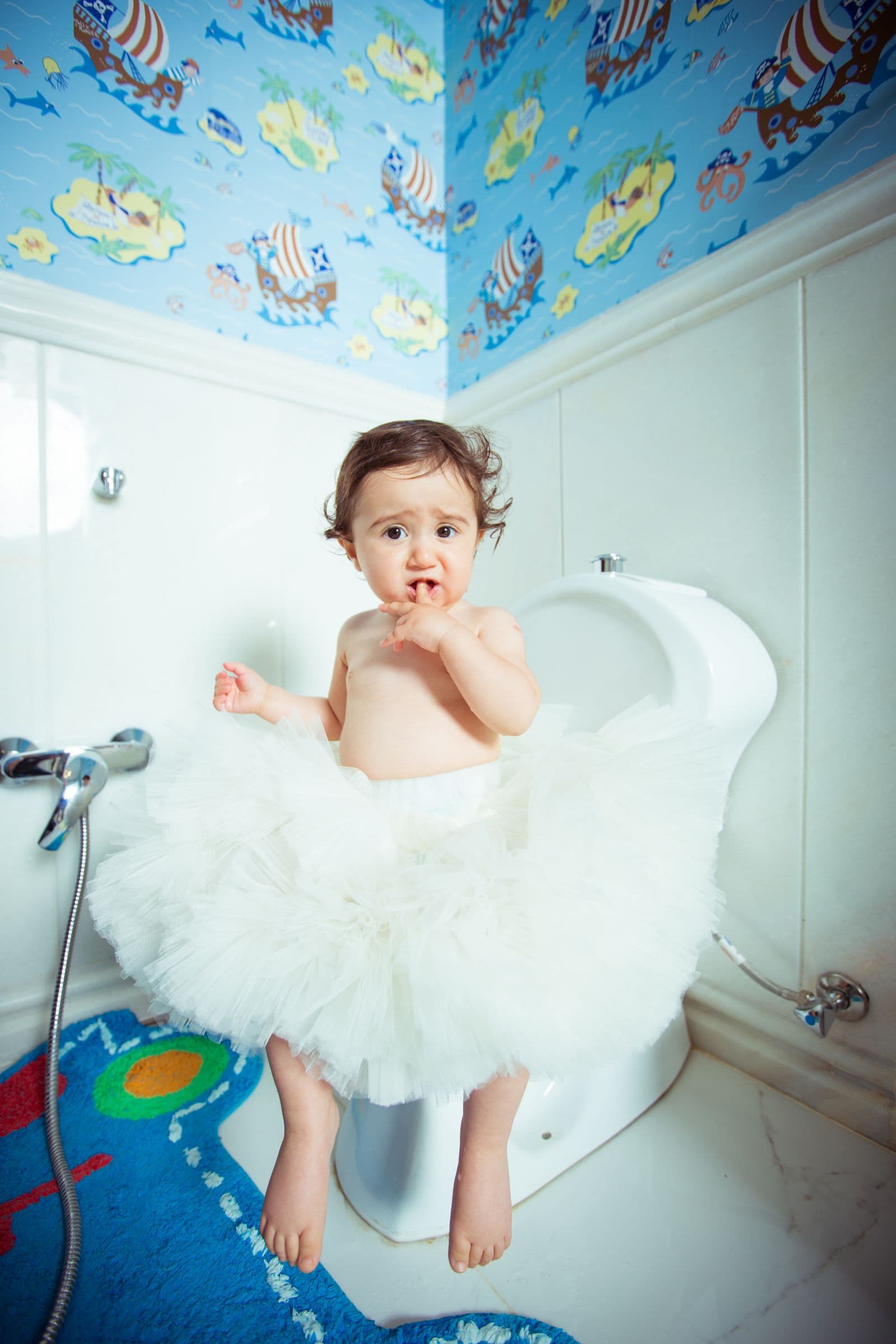 A toddler sitting on a potty during toilet training