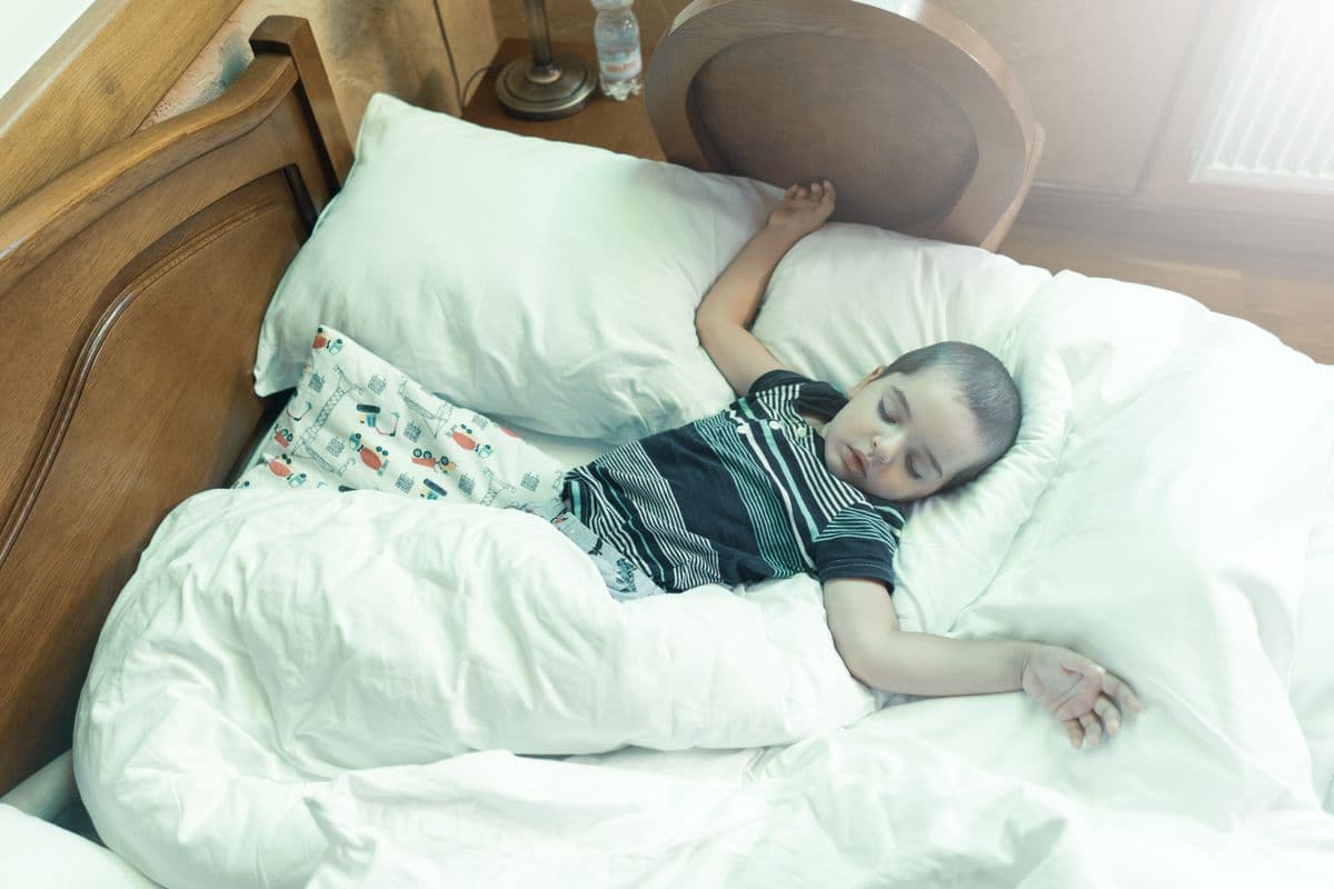 A child sleeping peacefully in bed