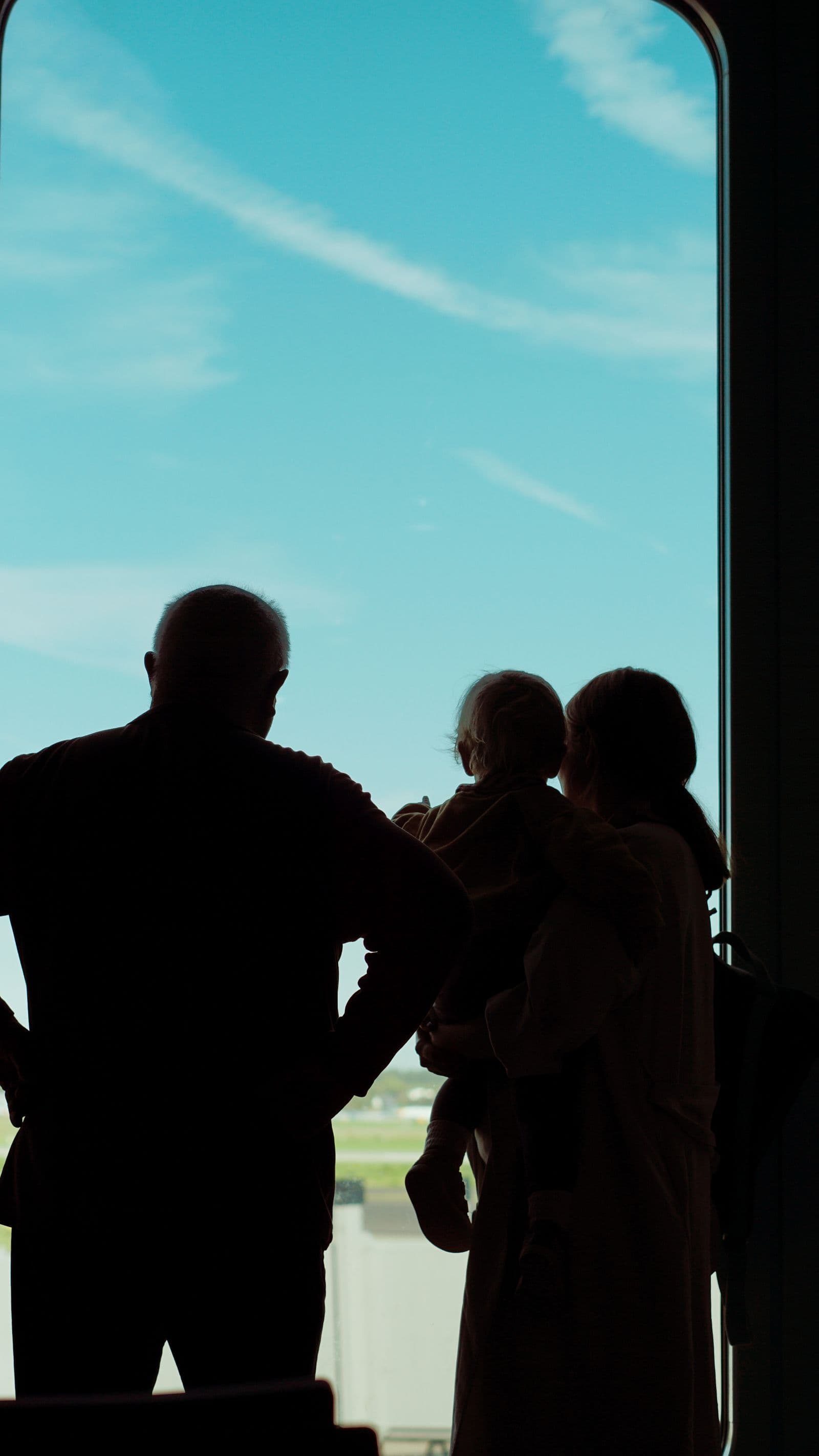 A family at an airport window