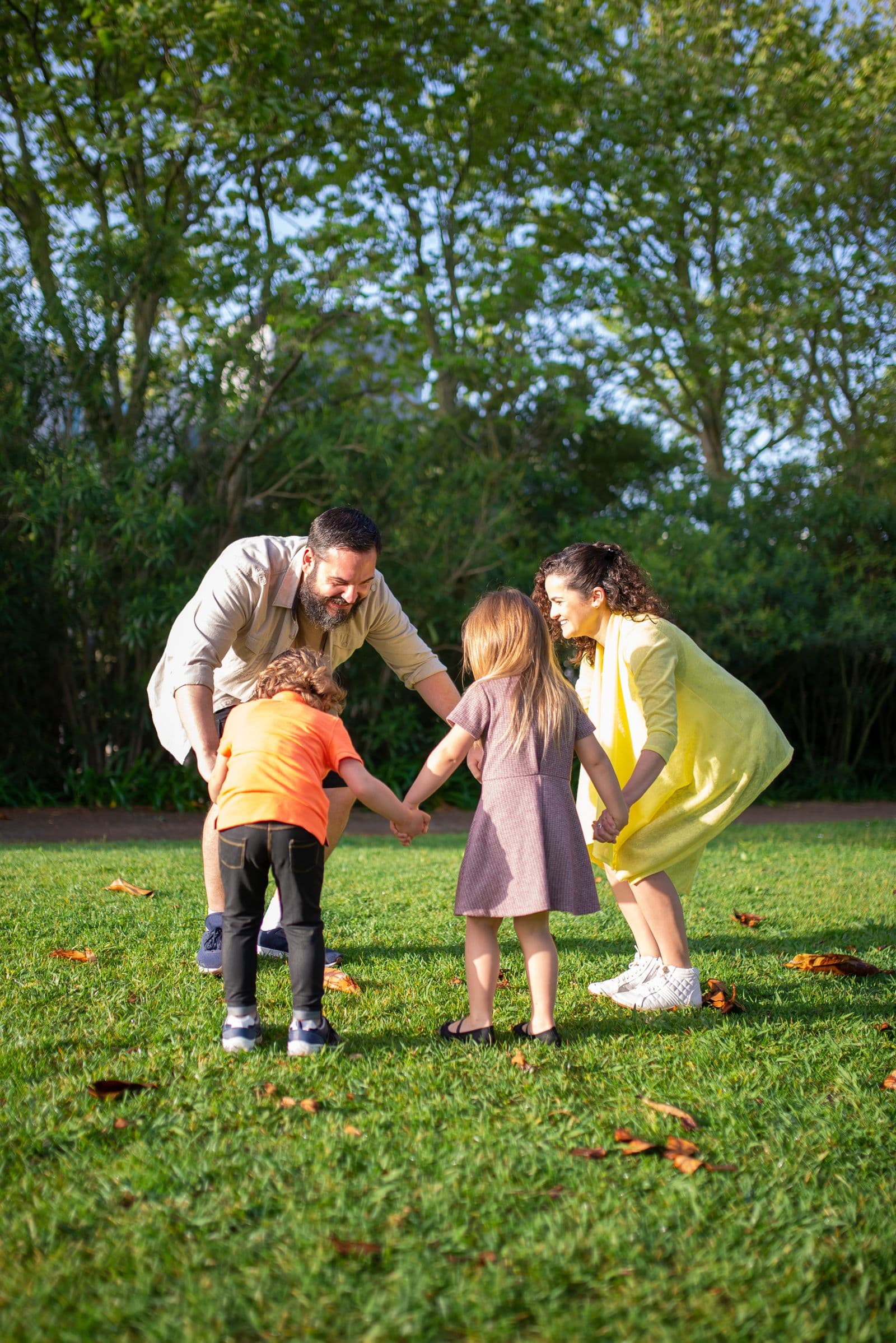 A family enjoying simple time together outdoors at a park