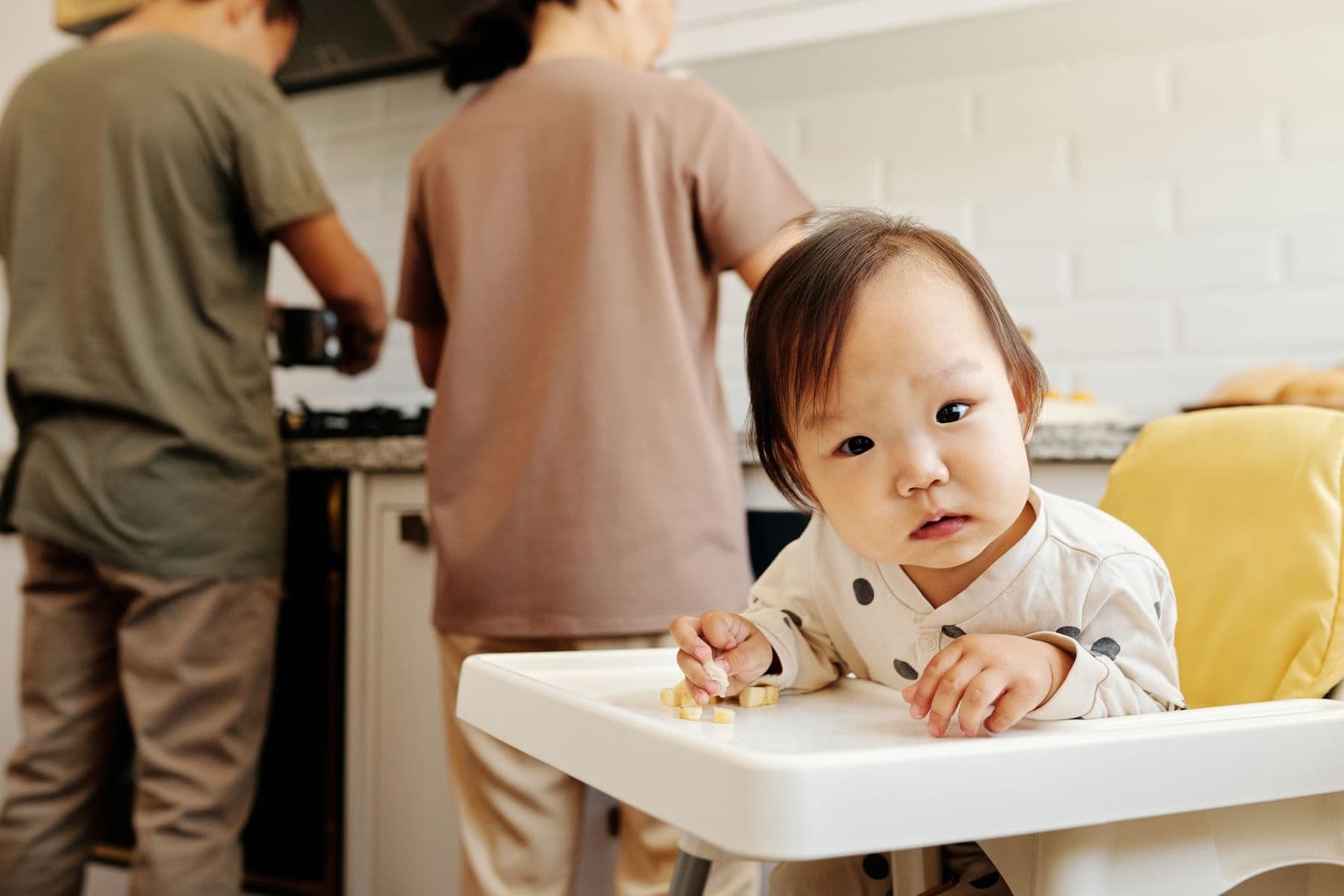 A toddler sitting in a high chair