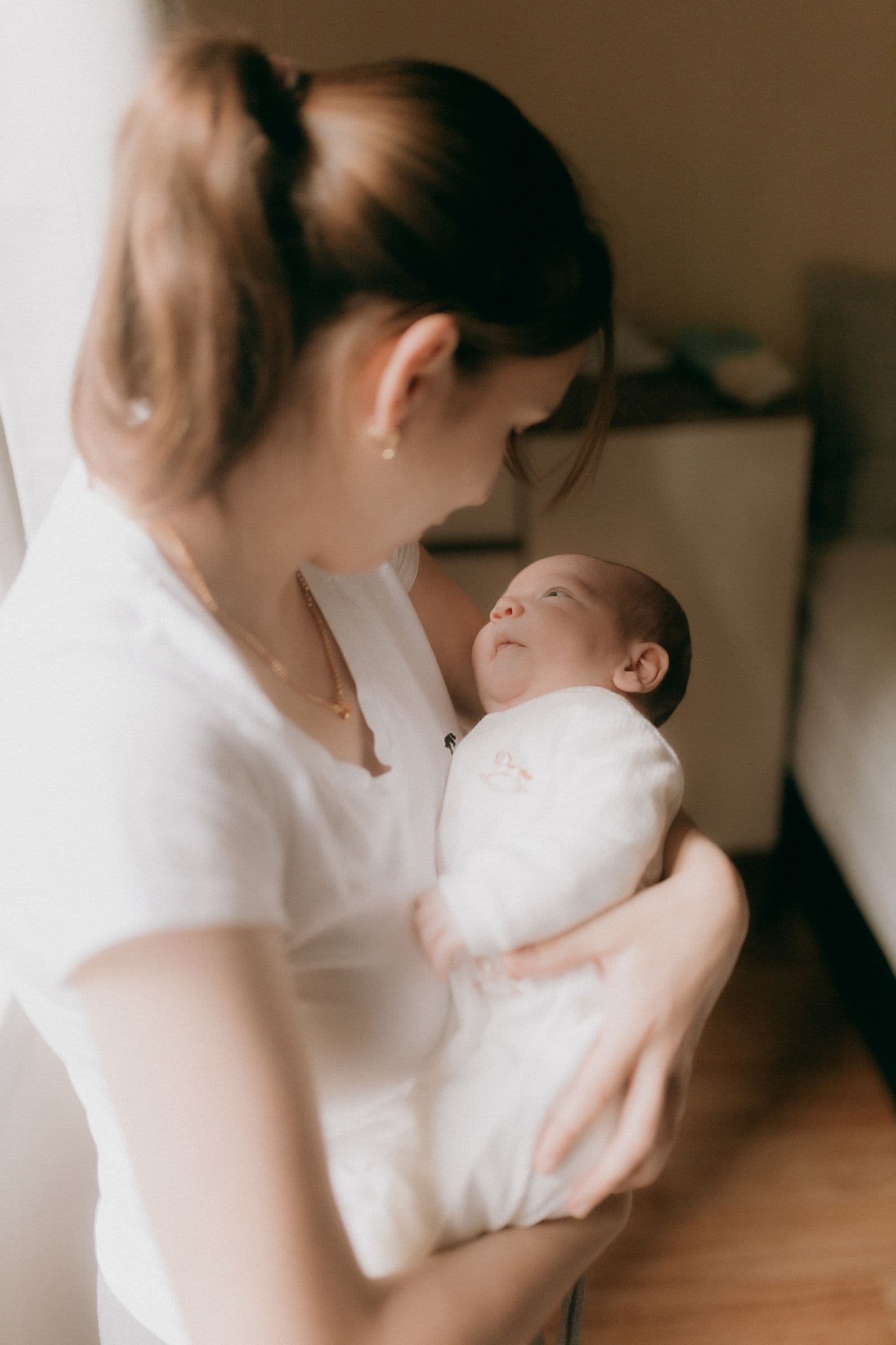 A parent tenderly holding their child