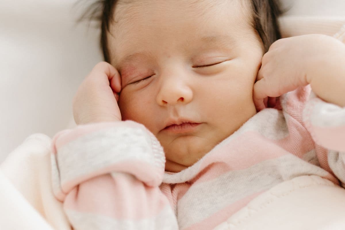 A newborn baby sleeping peacefully