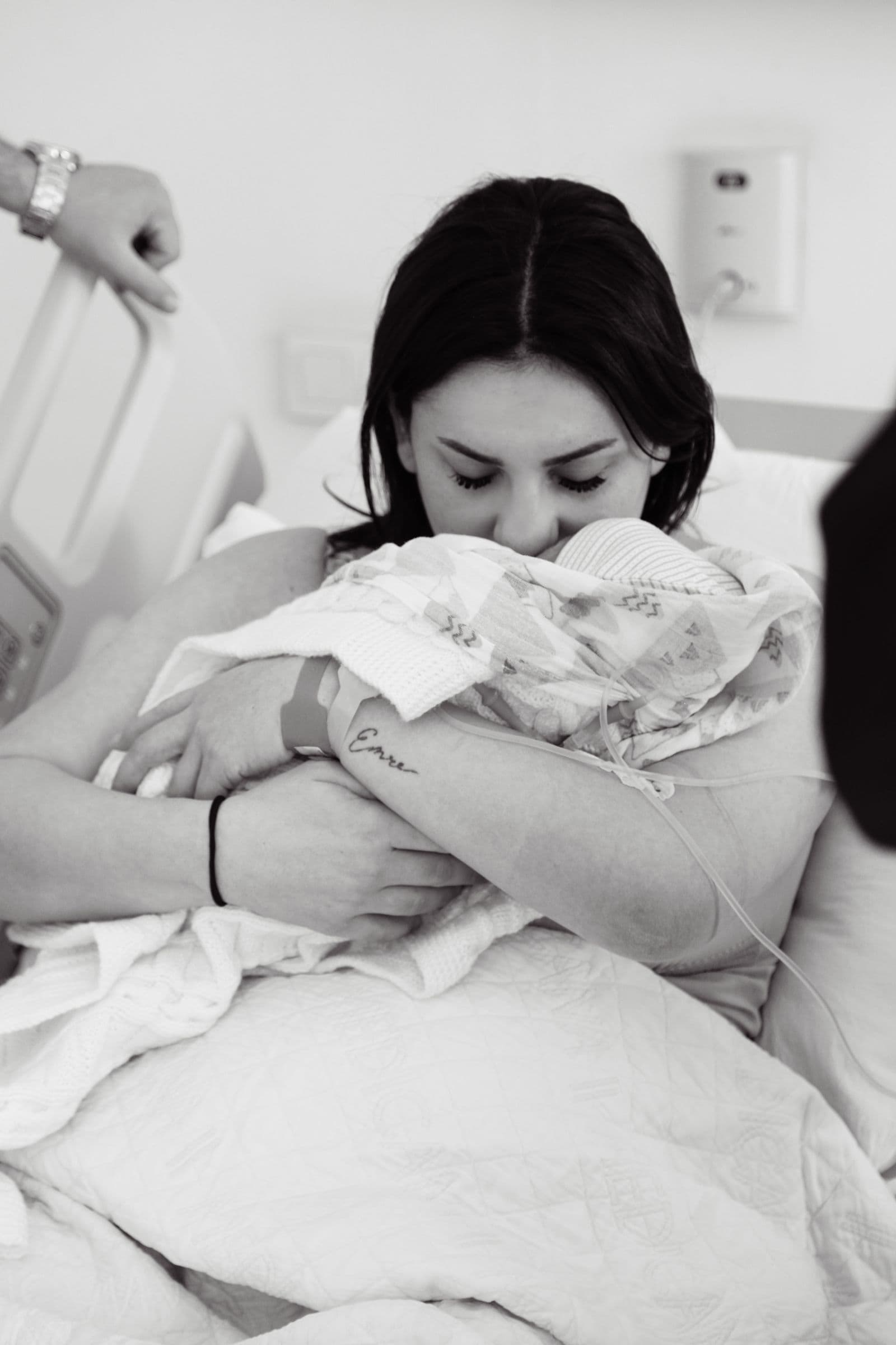 A mother holding her newborn