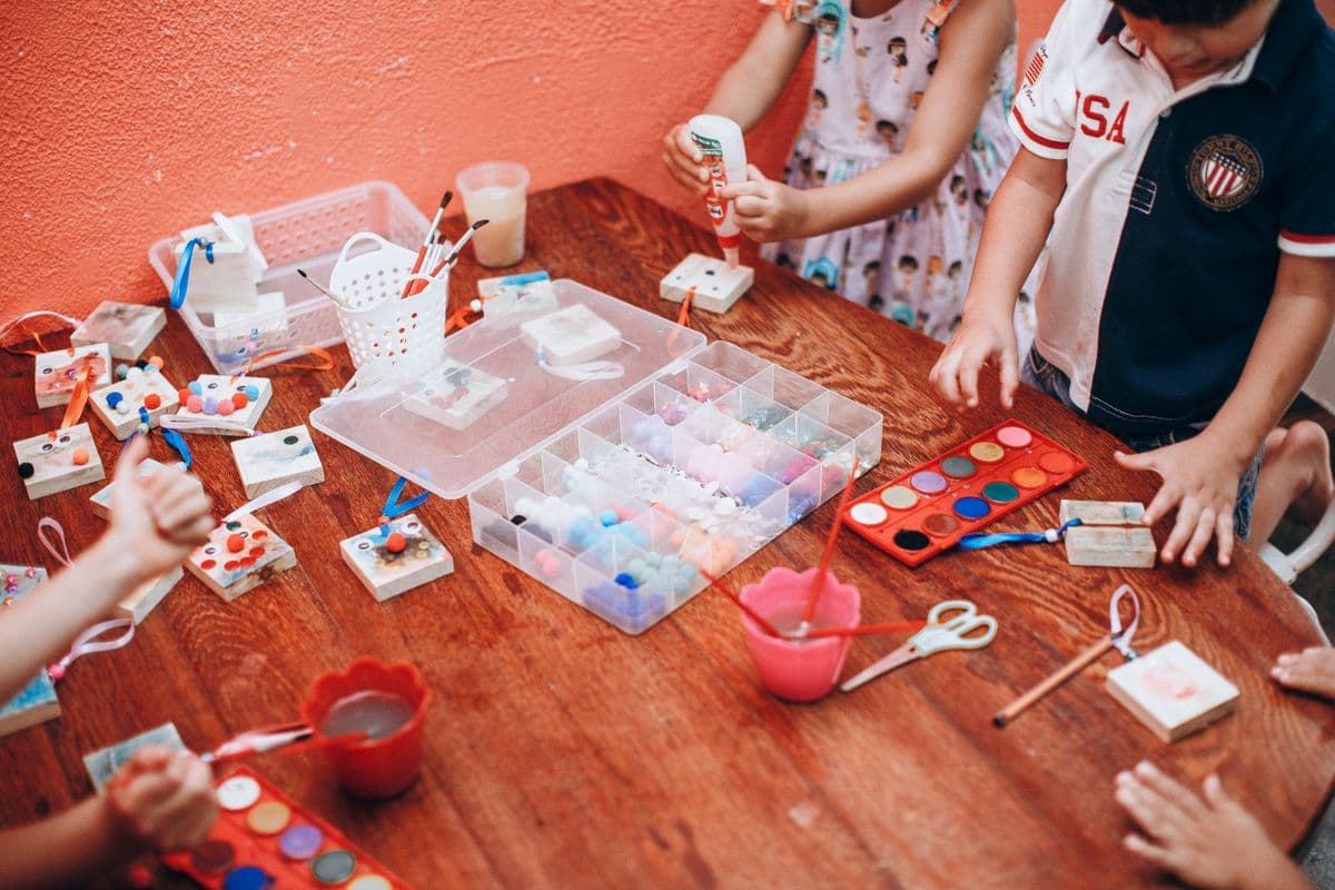 Children building with blocks at a kitchen table